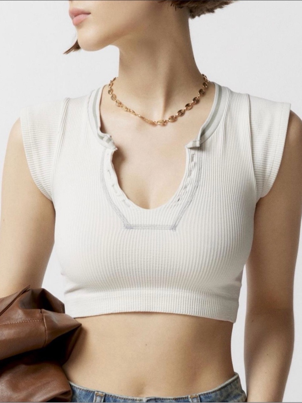 (Xs) out from under crop top
